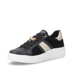 Baskets femme noires avec semelle plateforme et détail libellule dorée. Confort et style parfaits pour le quotidien.