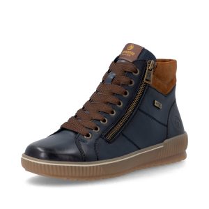 Le Remonte D0772-17 est un bottillon en cuir au look d’espadrille montante. Son mélange de bleu marine et de détails camel lui donne juste assez de caractère pour réveiller un jeans, sans t’obliger à repenser toute ta garde-robe. Les lacets permettent de bien l’ajuster, puis les fermetures éclair facilitent l’enfilage. Sa largeur confort et sa semelle intérieure amovible en font aussi un excellent choix pour les pieds qui veulent de l’espace… et les clientes qui ne veulent pas négocier avec leurs chaussures toute la journée. Dessus en cuir véritable Bleu marine avec détails camel Membrane RemonteTEX résistante à l’eau Largeur confort Semelle intérieure coussinée et amovible Lacets et fermetures éclair Semelle extérieure flexible et adhérente Une belle solution pour celles qui aiment le noir… mais qui sont prêtes à vivre une petite émotion vestimentaire. 😅